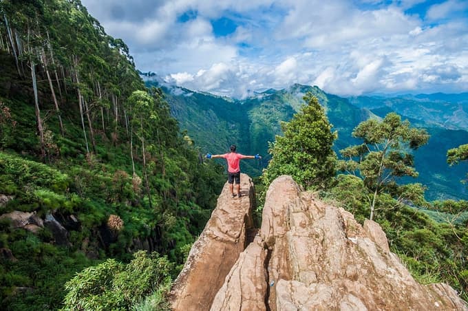 Man enjoying on hihghest opeak of Dolphin's Nose, Ooty